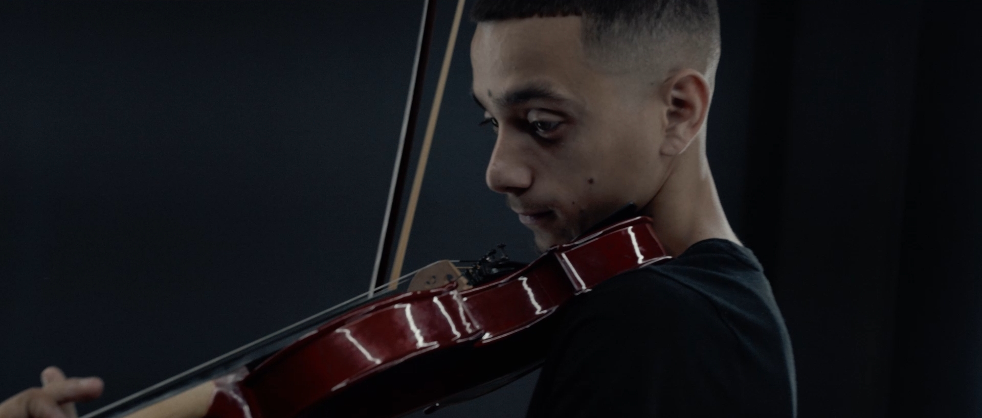 A still frame of Violin player