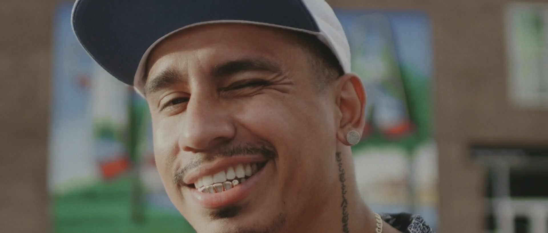 A still frame of rapper Loso in "run it up" music video by A-Ram