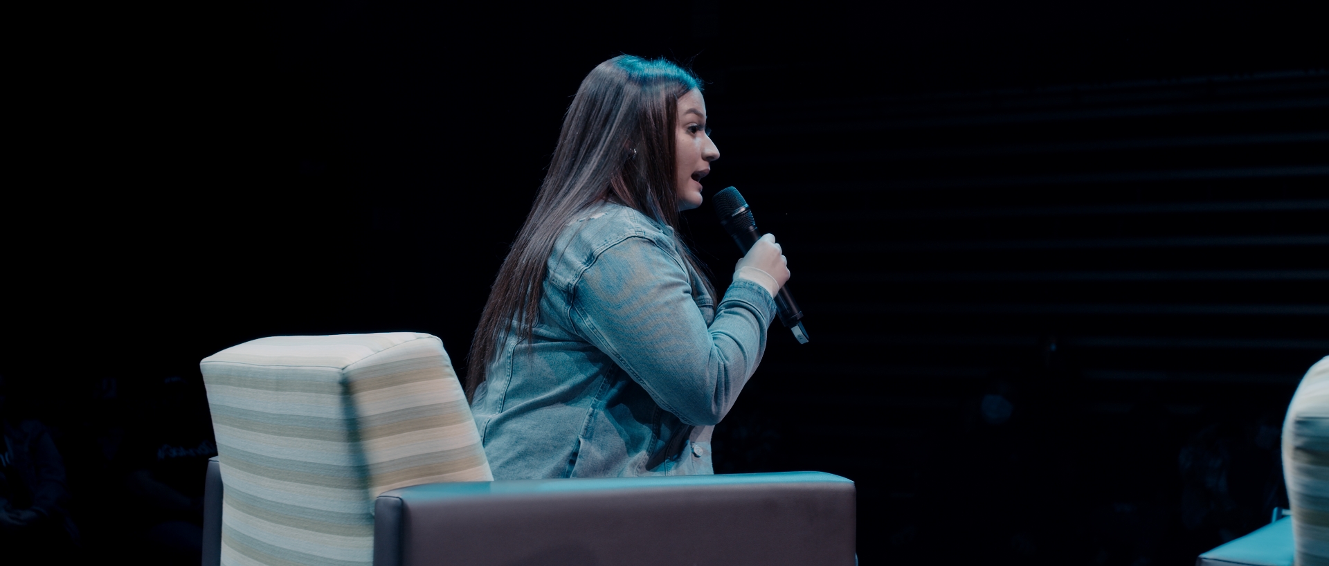 A young lady speaks at live event