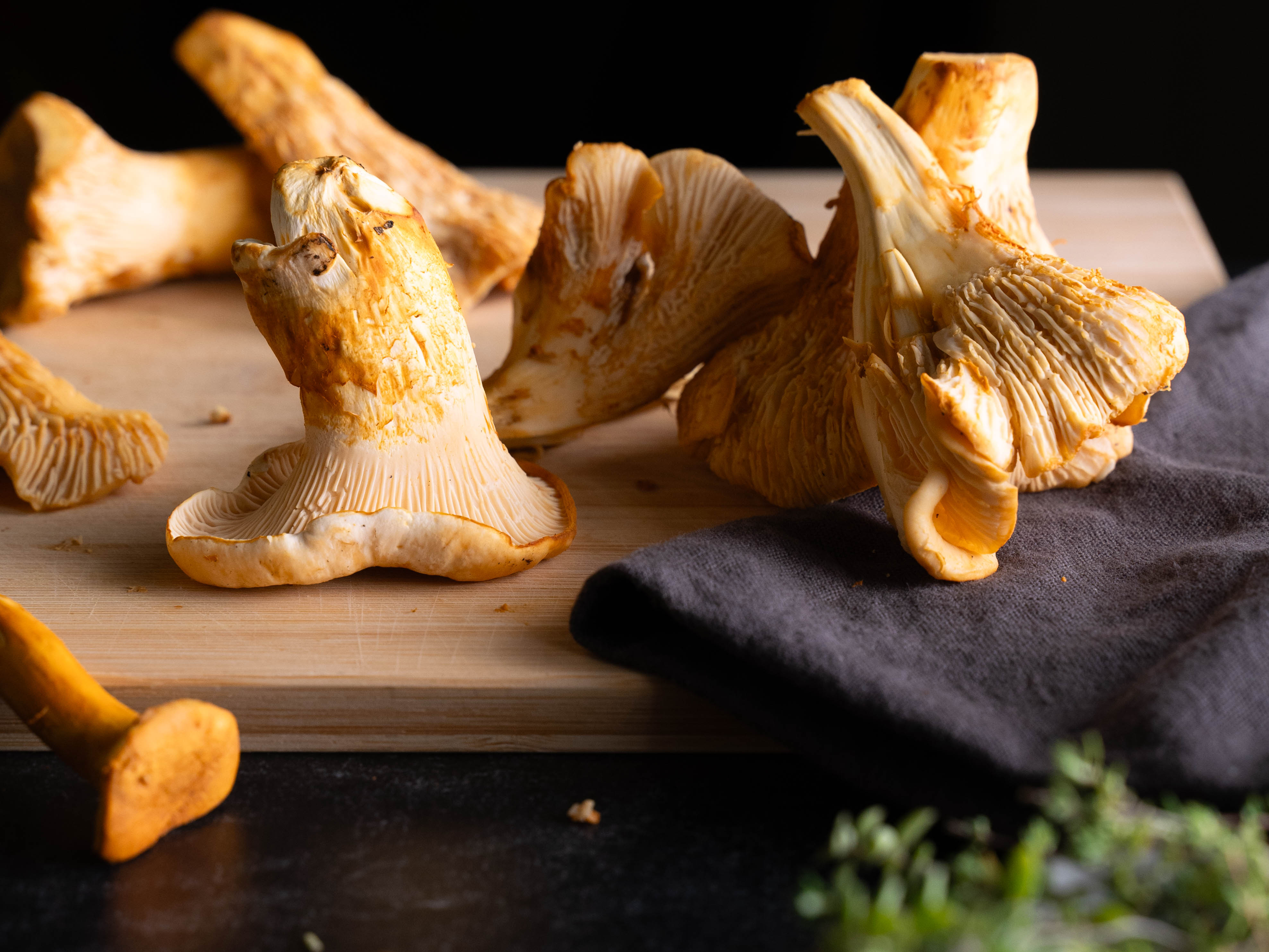 Fresh chanterelle mushrooms on a cutting board
