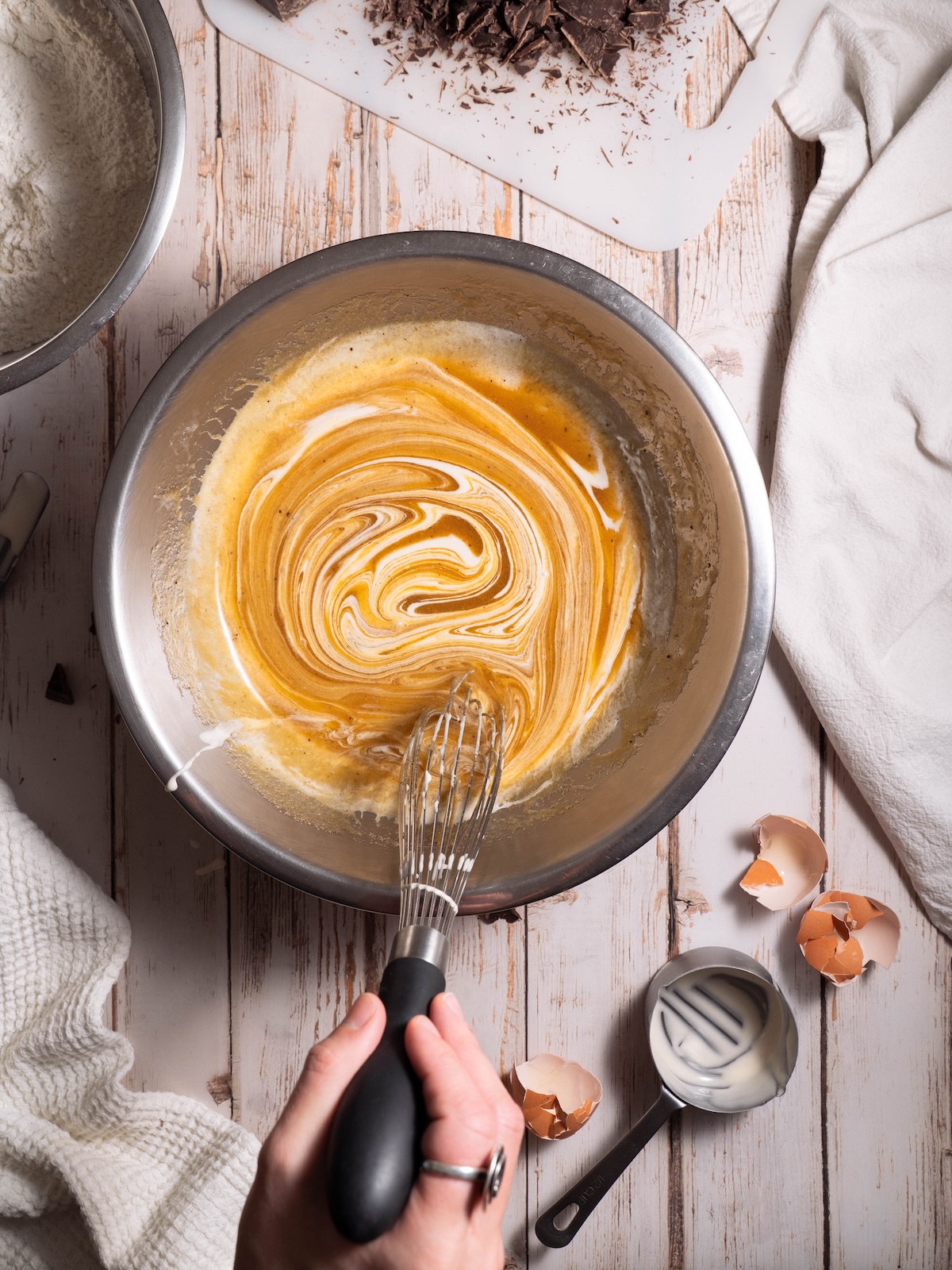 Whisking ingredients together in a mixing bowl