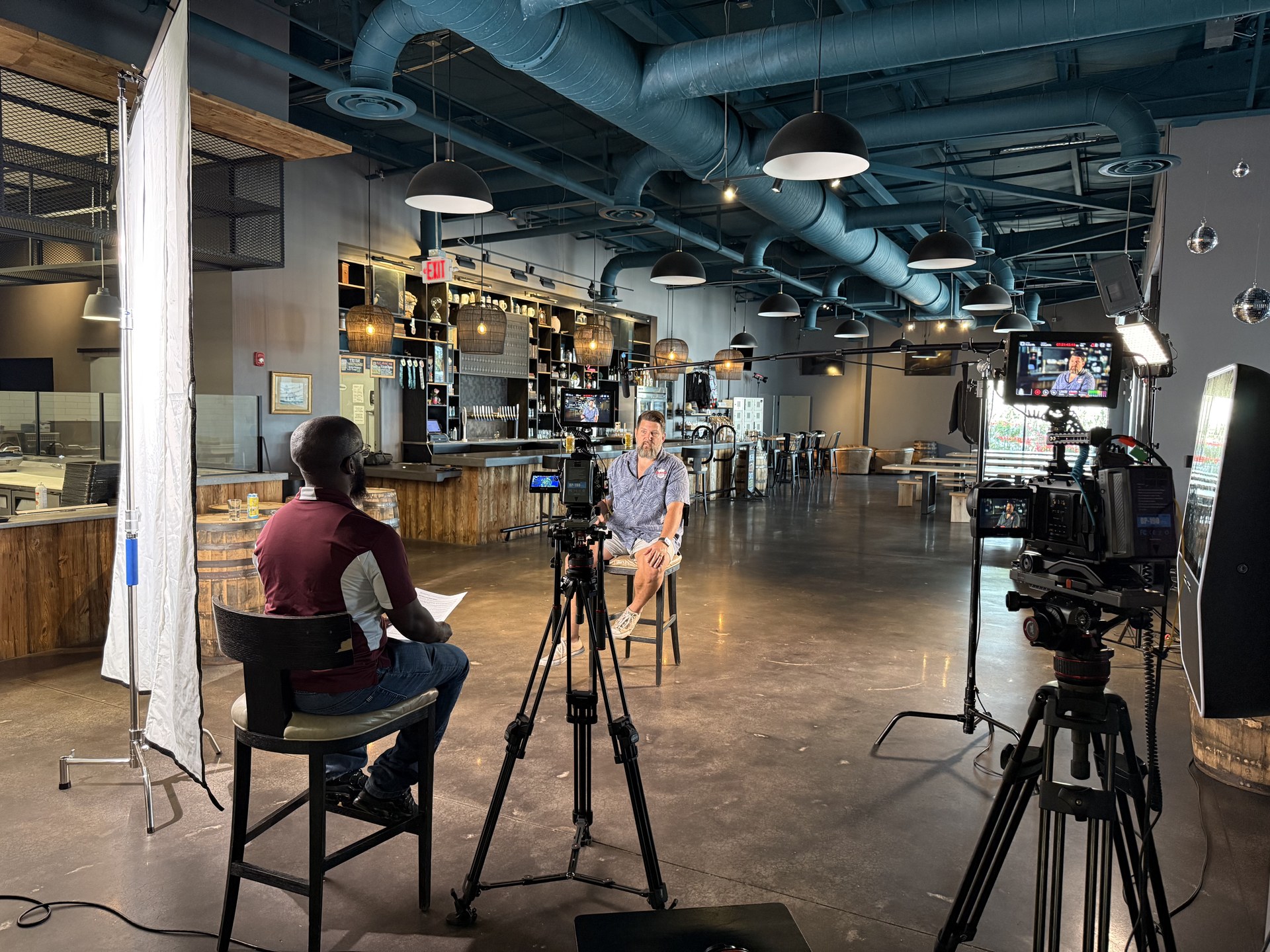 OBT NEXT — Ivanhoe Park Brewing, full brewery interior interview setup with bar in background