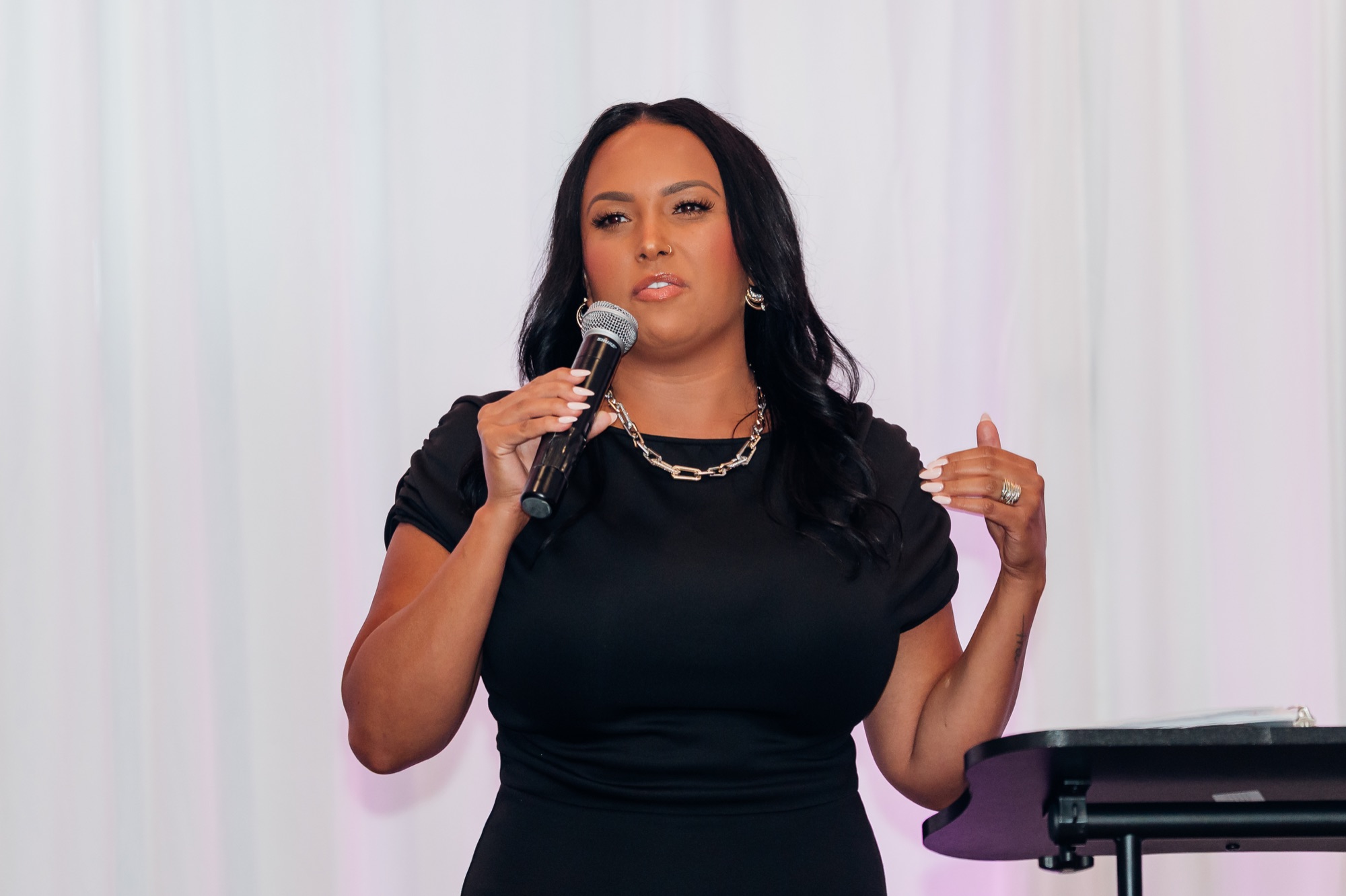 Road to Freedom Gala, speaker sharing her story at the podium