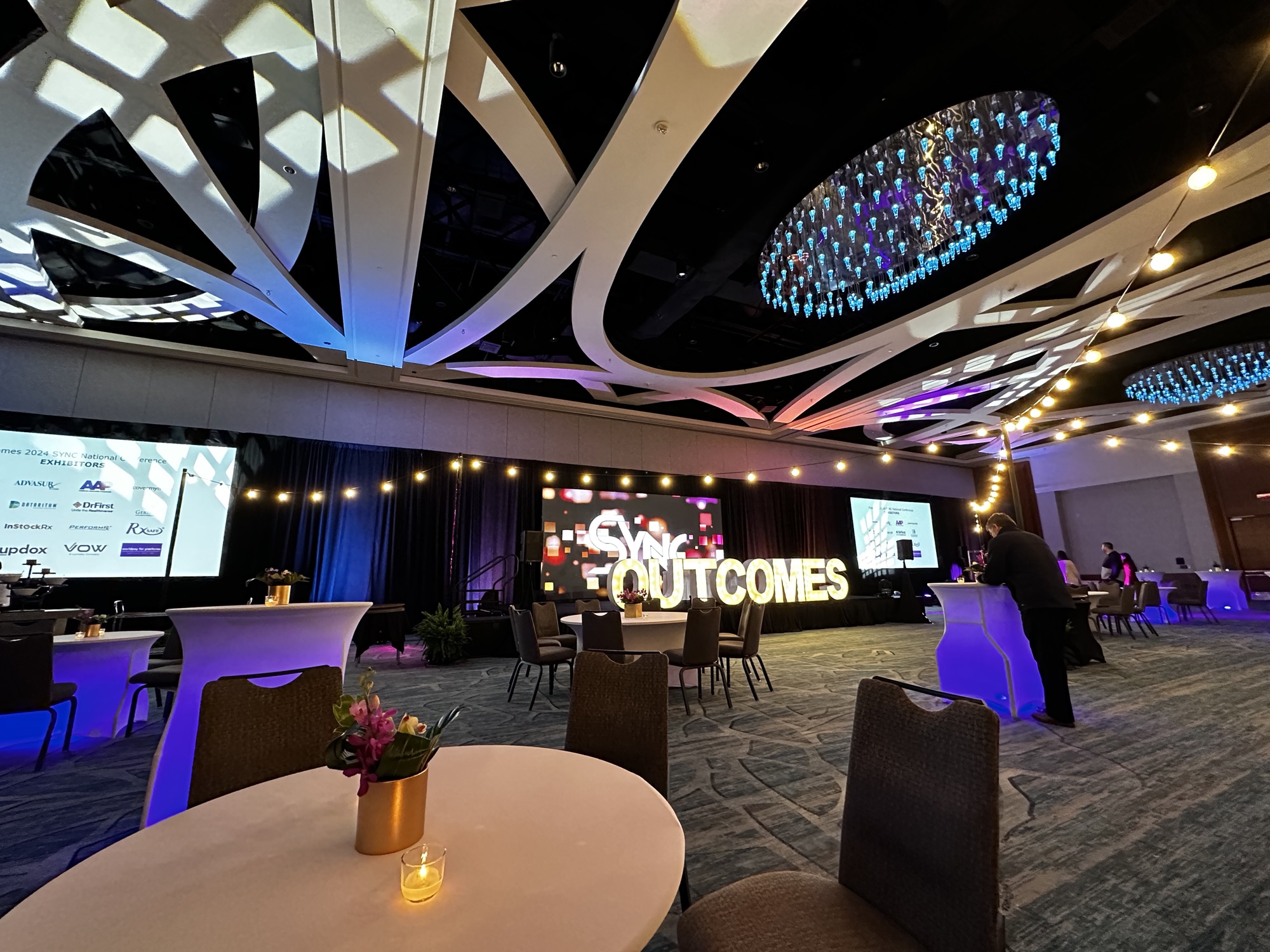 Outcomes SYNC Conference, Outcomes marquee stage with string lights