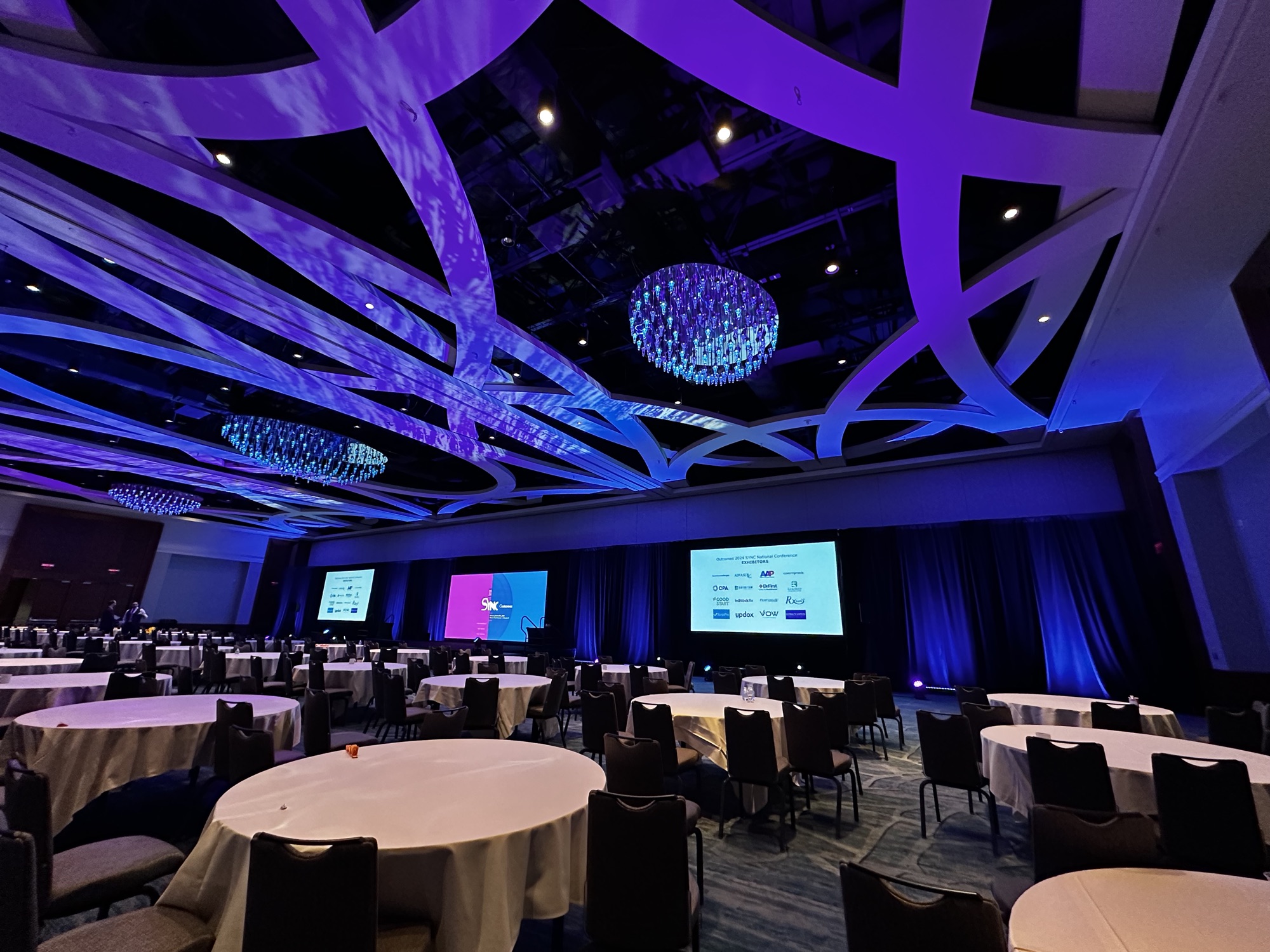 Outcomes SYNC Conference, banquet rounds set before doors