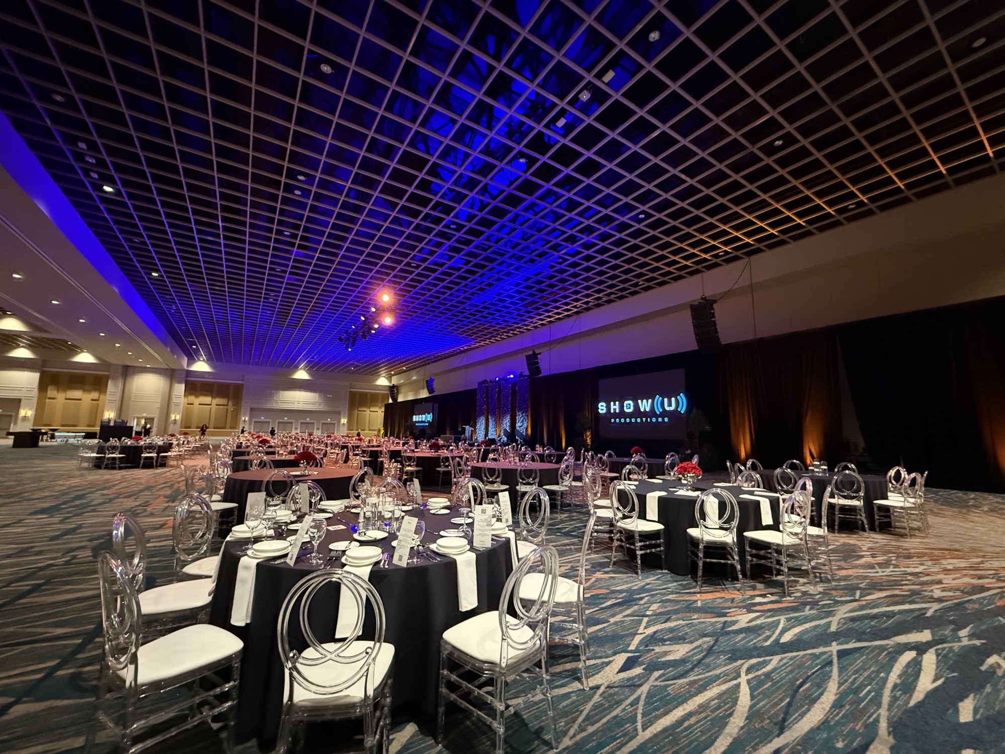 The Faine House Gala, banquet seating facing the stage screens