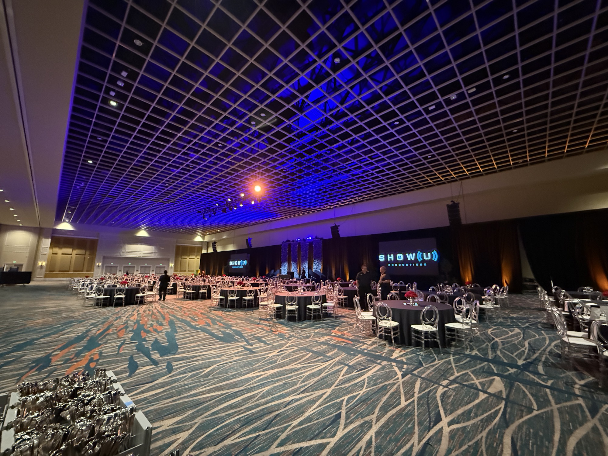 The Faine House Gala, room set with blue uplighting during build