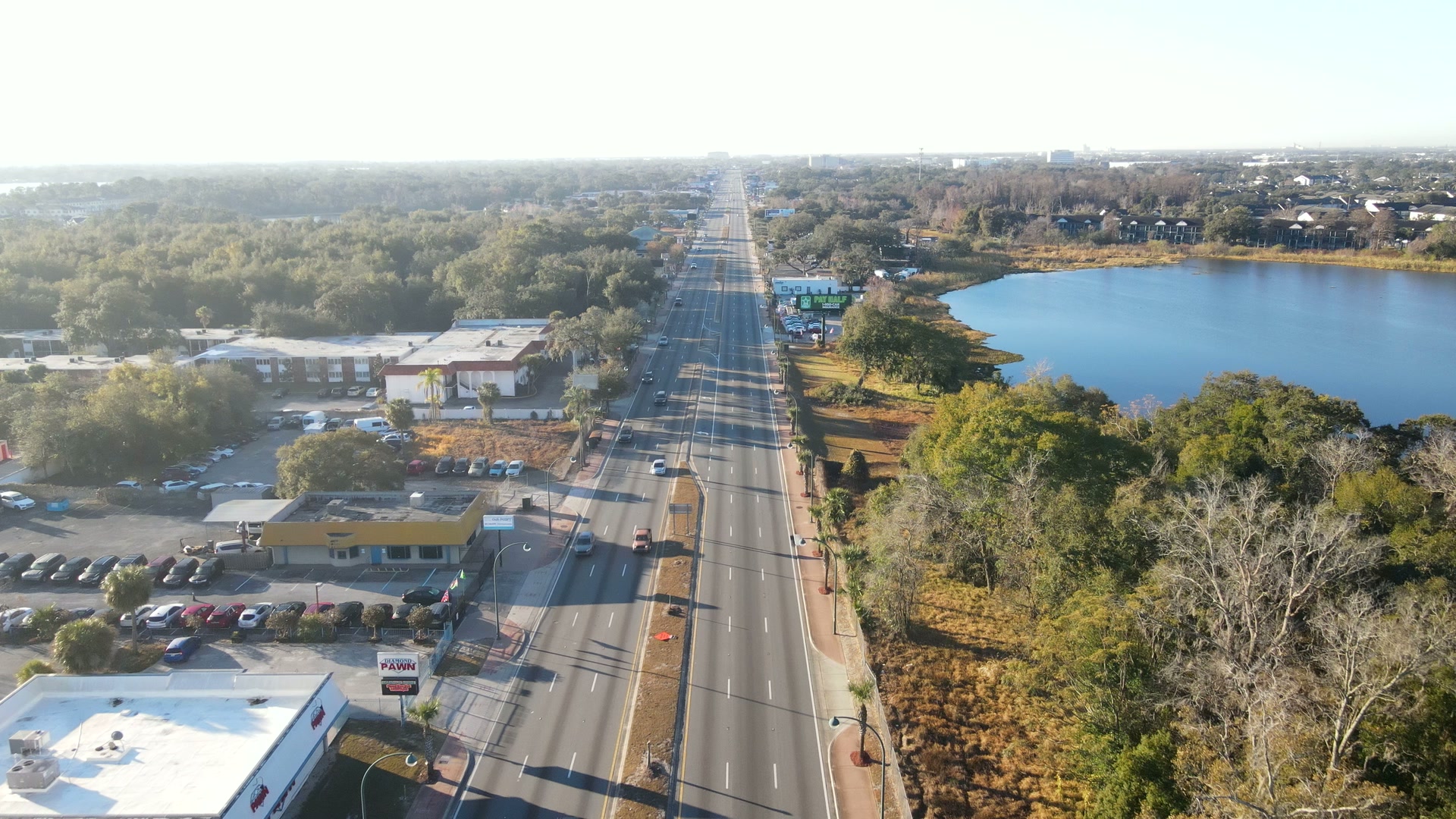 Orange Blossom Trail running beside a lake, South Orlando, from above