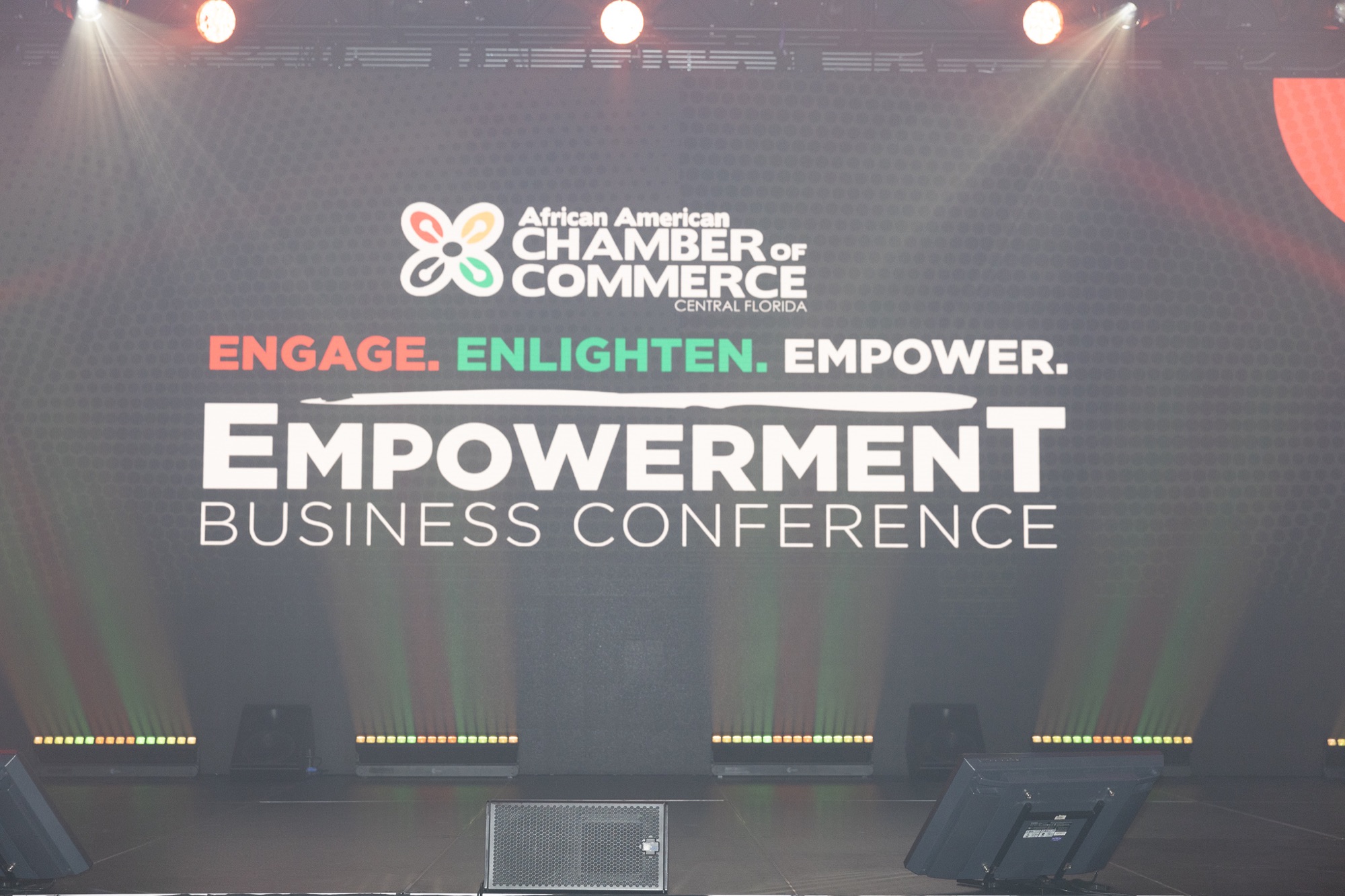 The Empowerment Business Conference stage with African American Chamber of Commerce of Central Florida branding