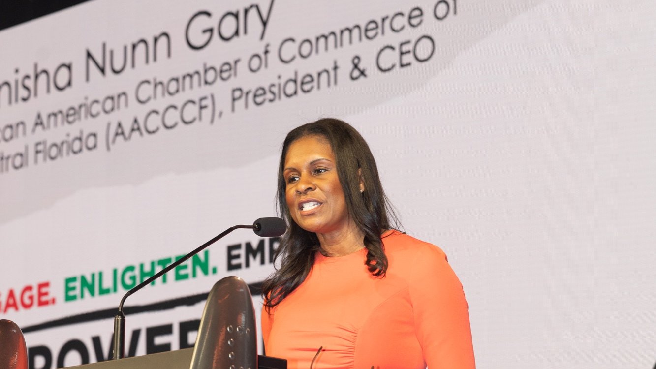 The chamber's President and CEO at the podium during the Empowerment Business Conference