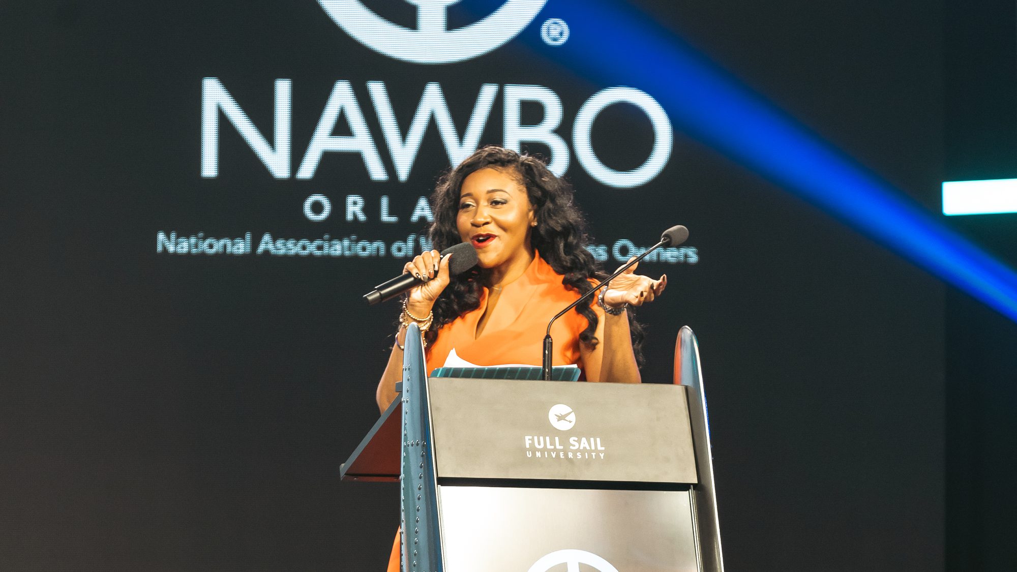 Opening remarks at the NAWBO Orlando podium