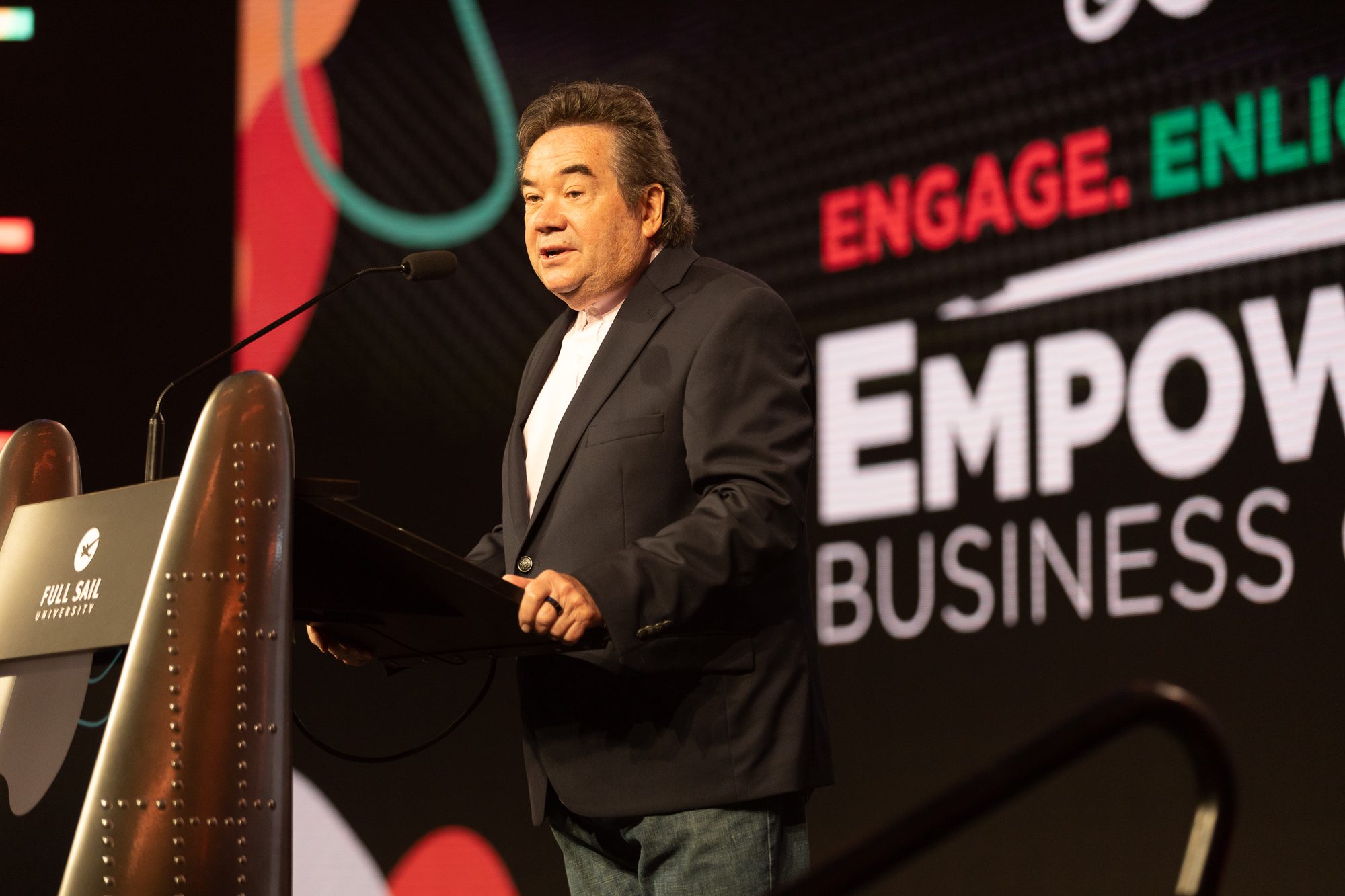 A keynote speaker on the Empowerment Business Conference stage