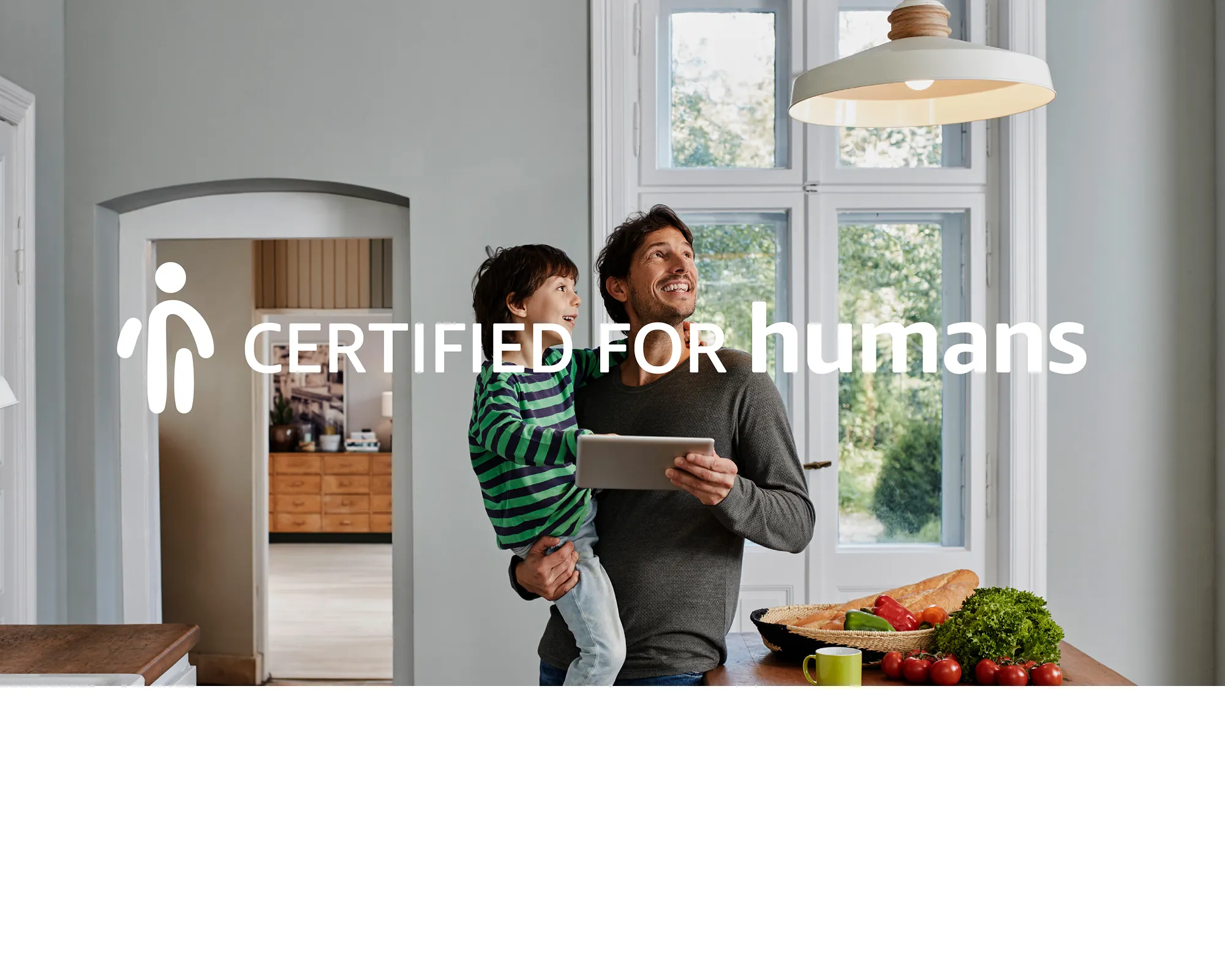 Certified for Humans graphic overlay on a photograph of a parent and his child
