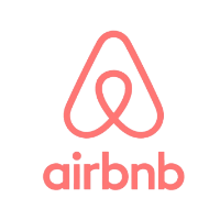 A pink logo for Airbnb.