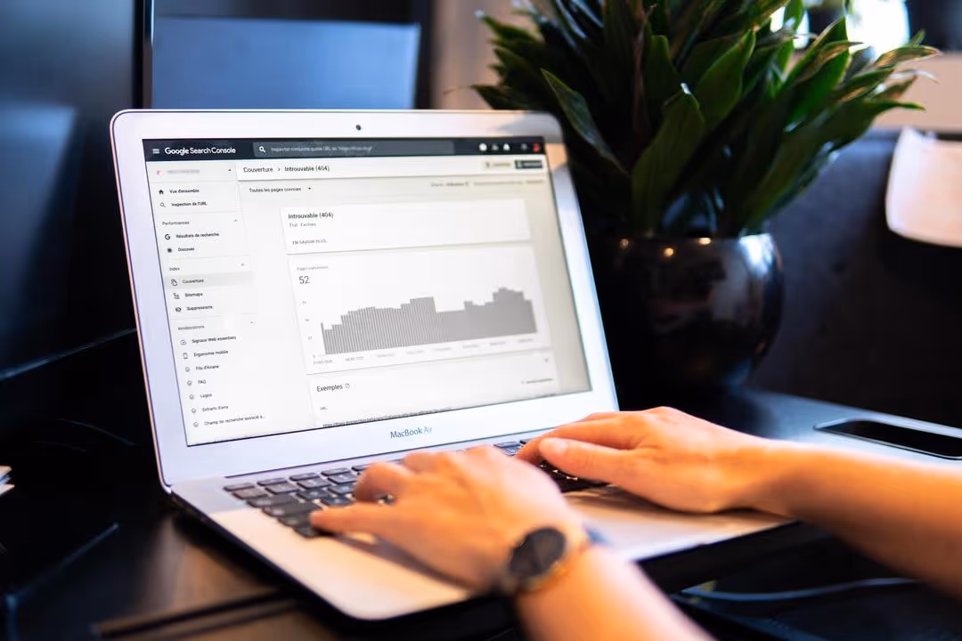 typing at laptop on desk