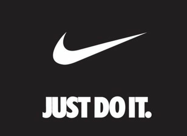 Nike logo and “Just Do It” slogan symbolizing brand attributes of motivation, performance, and empowerment