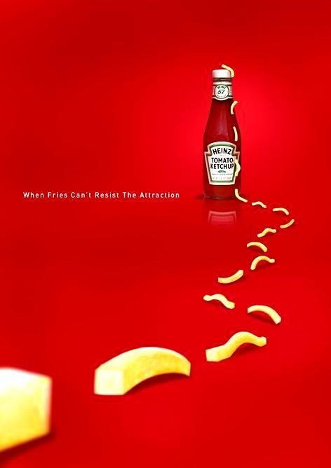 Heinz ketchup ad with fries crawling toward the bottle, showing they can't resist the attraction.