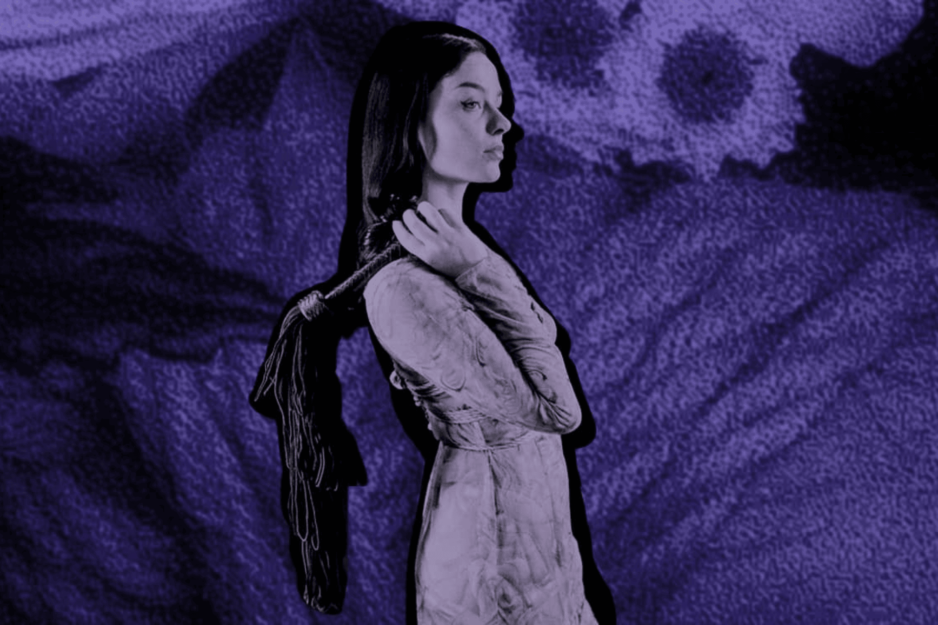 woman holding flogger against abstract purple background with ropes.