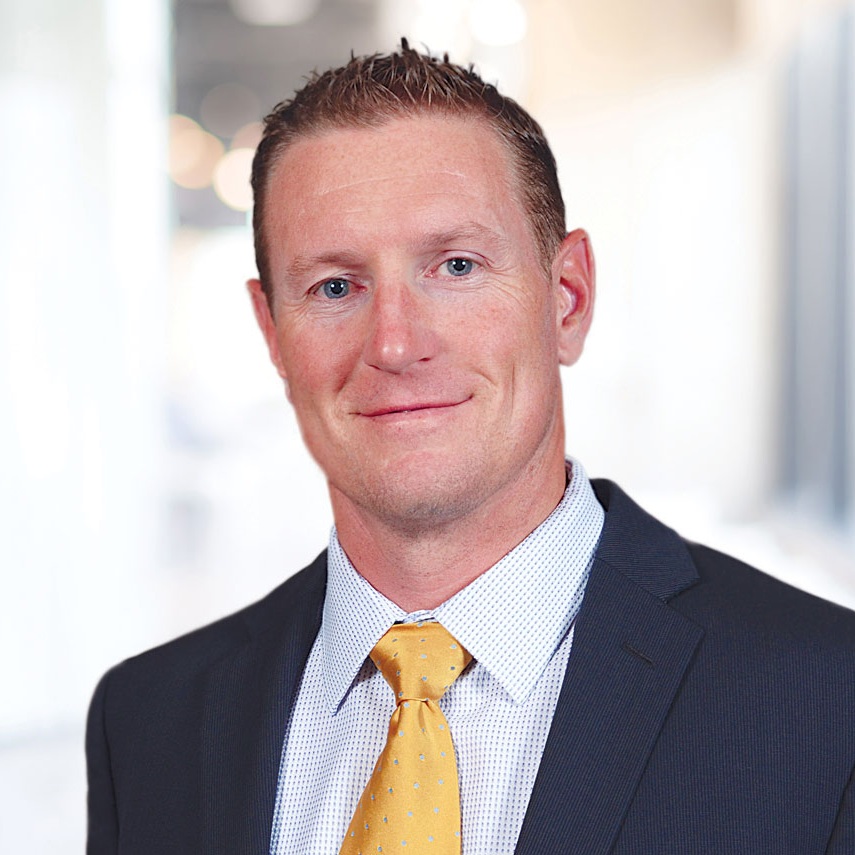 Kyle Mann corporate headshot in black and white