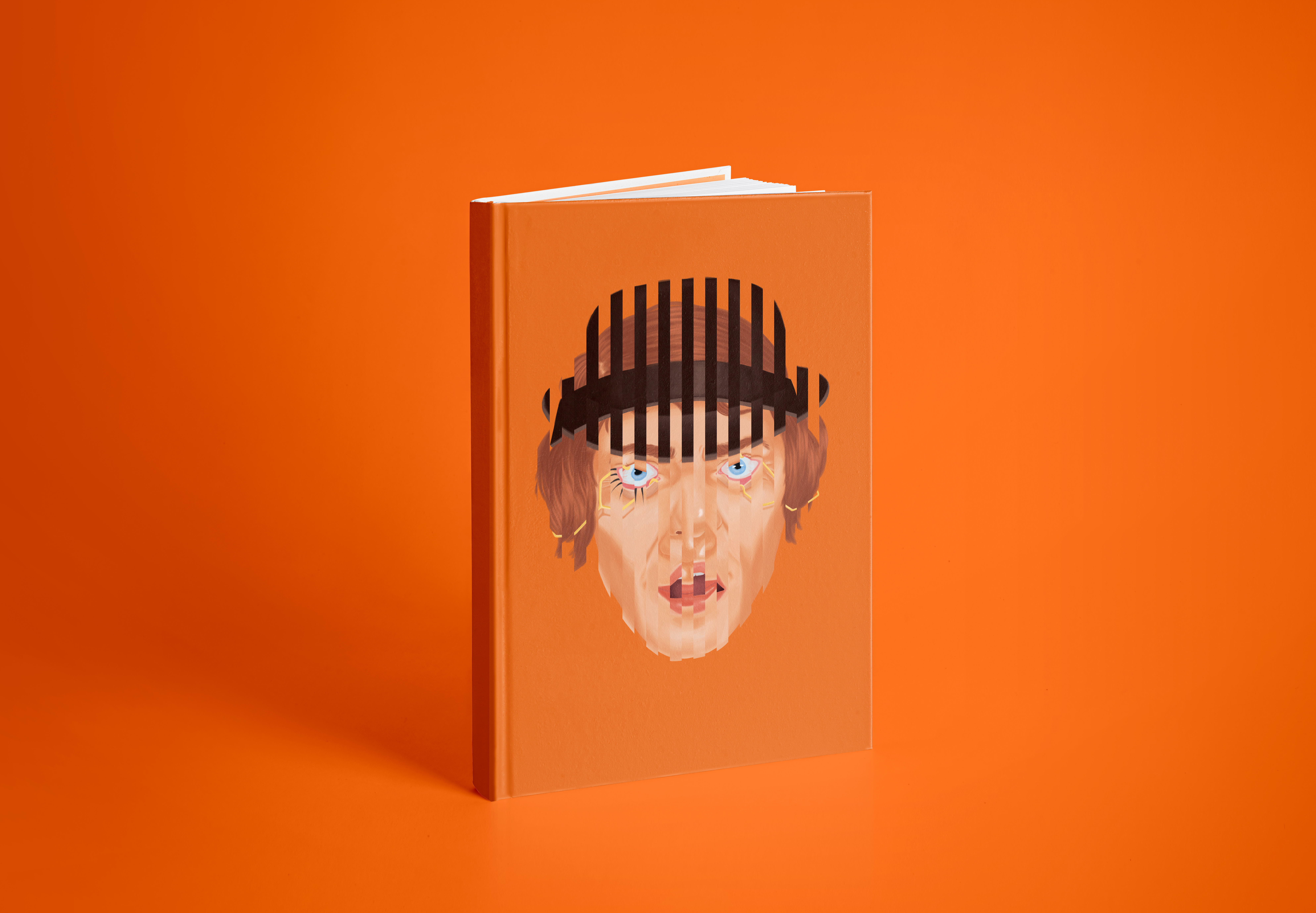 A Clockwork Orange book without the sleeve showing an illustration of Alex's spliced face