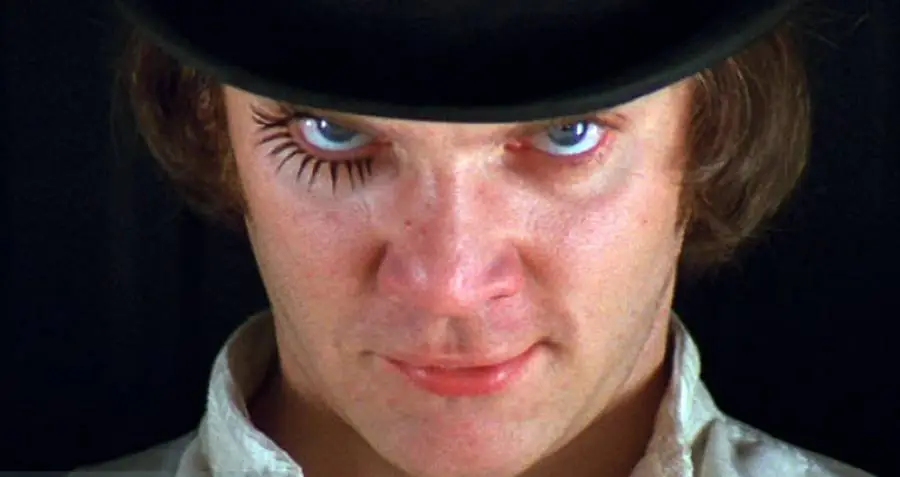 A frame from Stanley Kubrick's film adaptation of Clockwork Orange showing a close up of Alex's face looking up menacingly