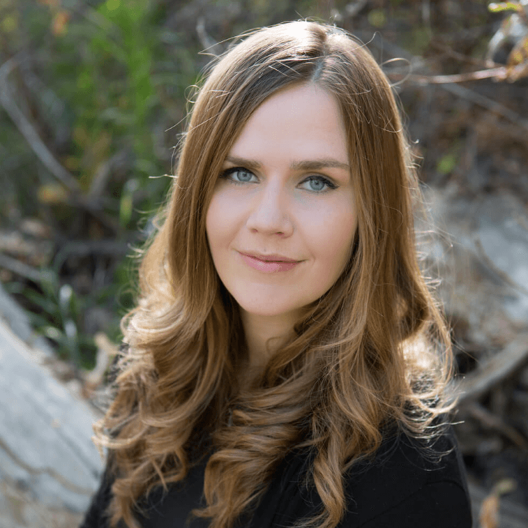 young business professional lady smiles outside in a professional heashot square social