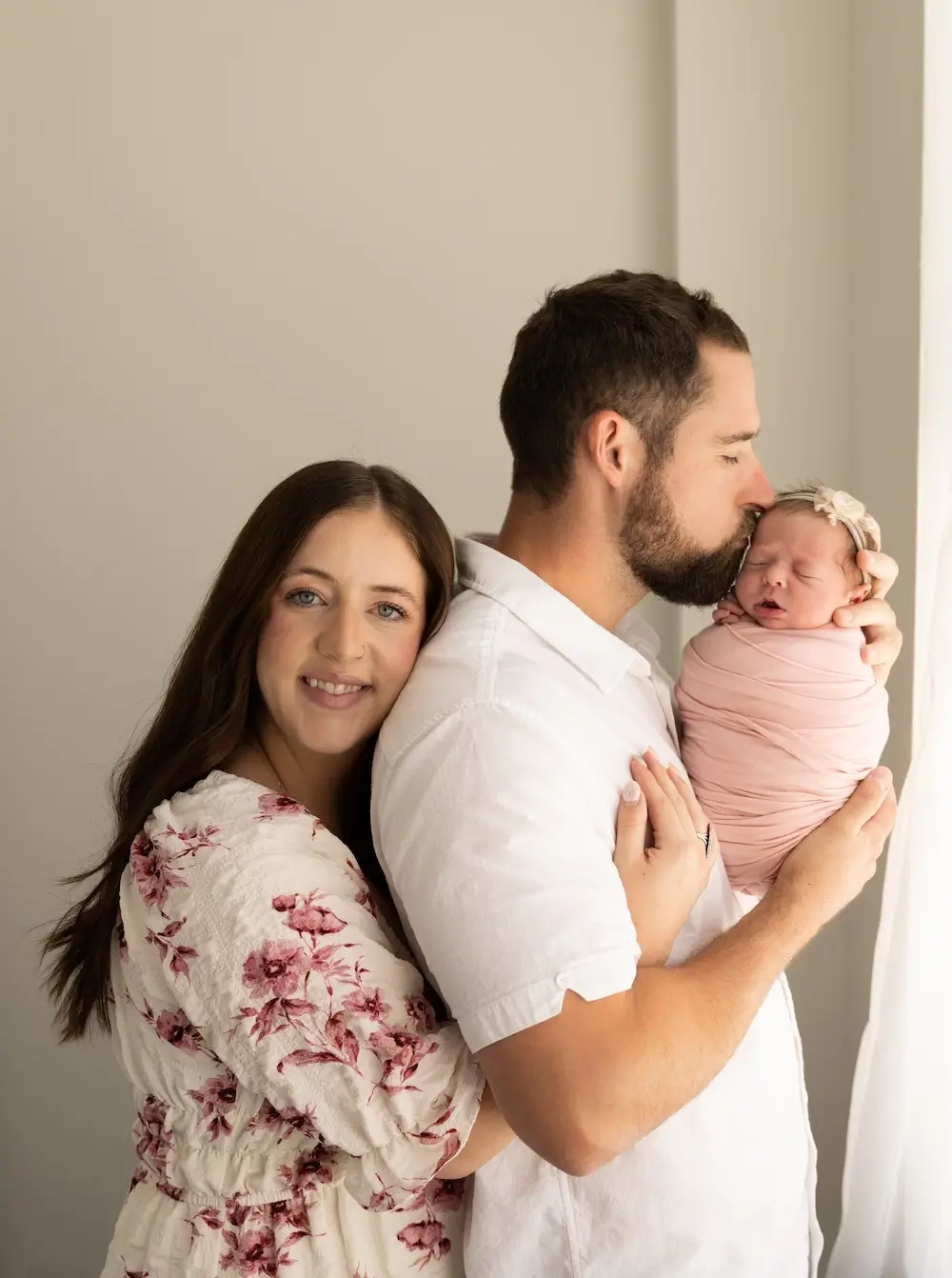 In-home newborn photography session capturing natural family moments in Billings, MT