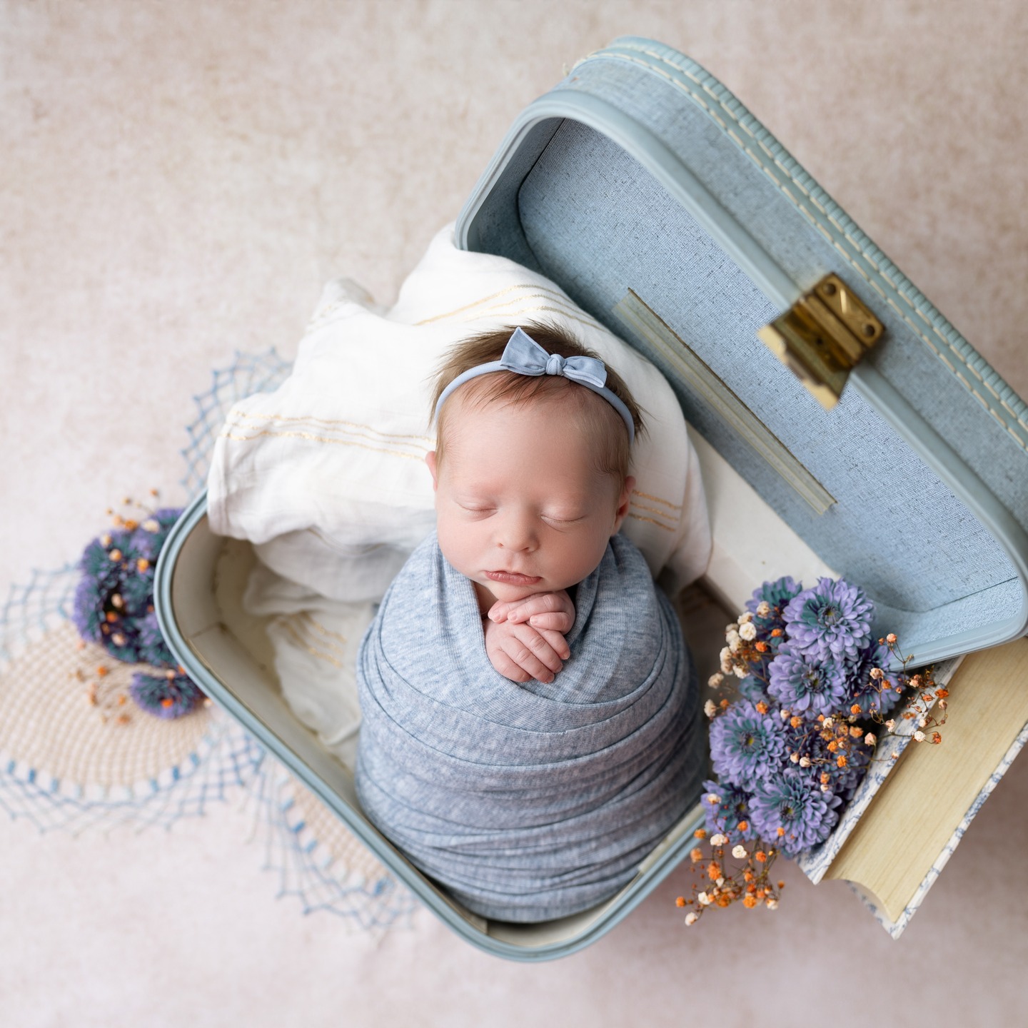 cute baby infant sleeps in suitcase newborn photoshoot newborn photography billings mt 