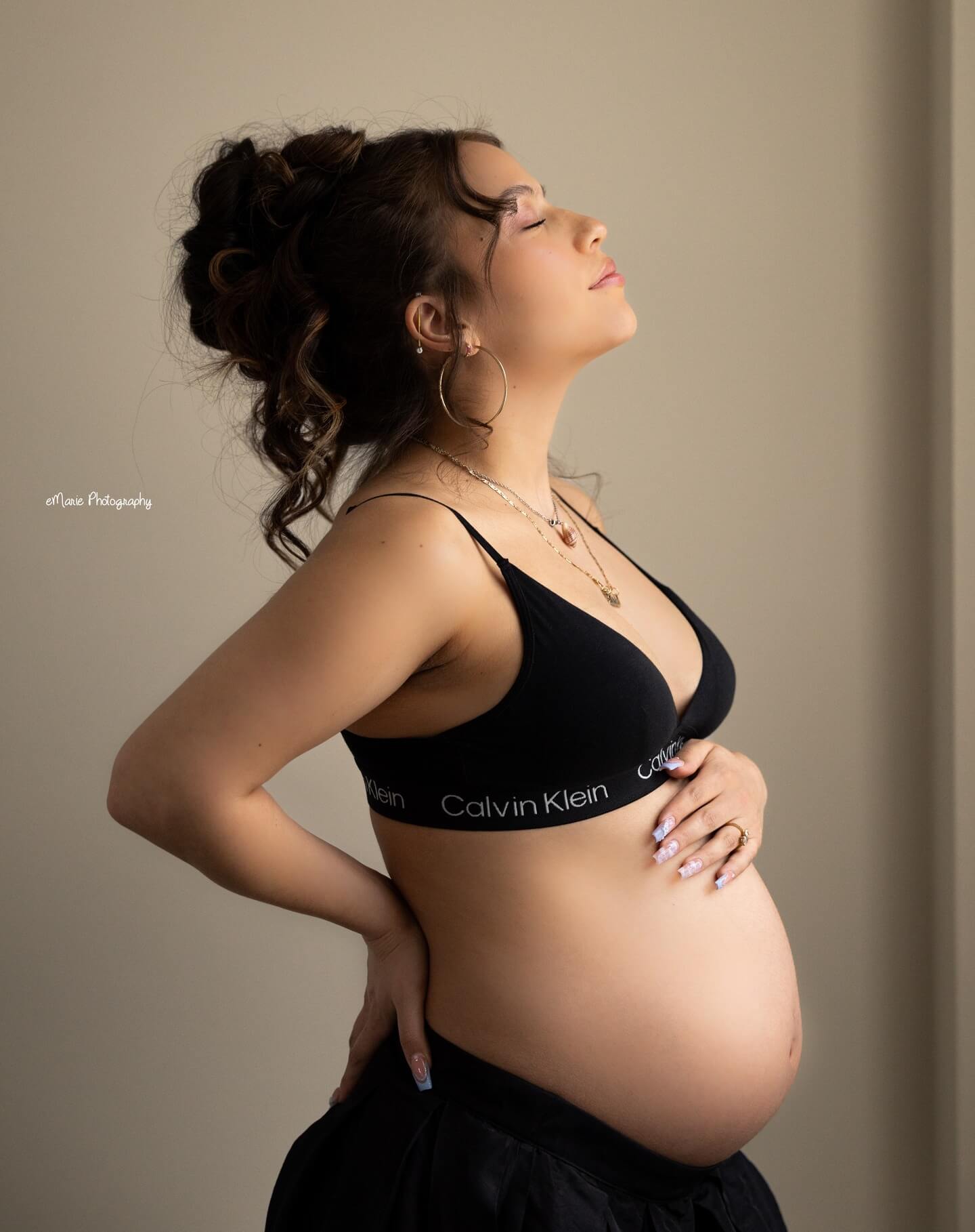 pretty mama poses in bra and baby bump billings mt maternity photography