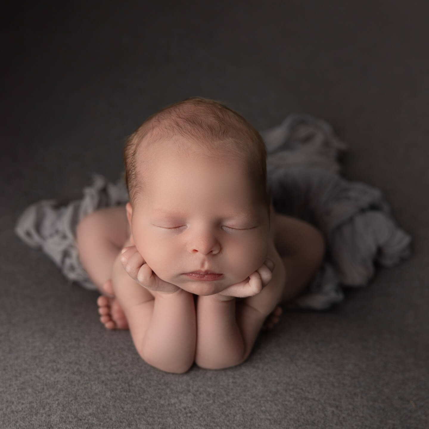 newborn in safe and composite froggy pose billings mt