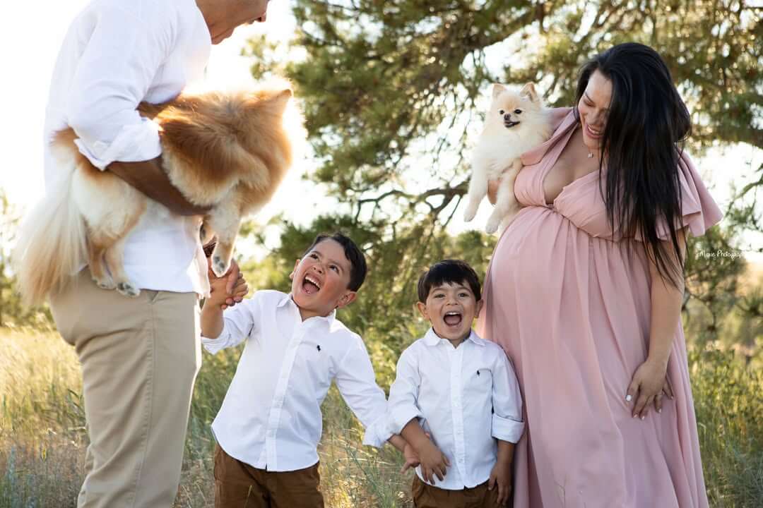 family photography outside with laughing boys and pomeranian dogs billings mt