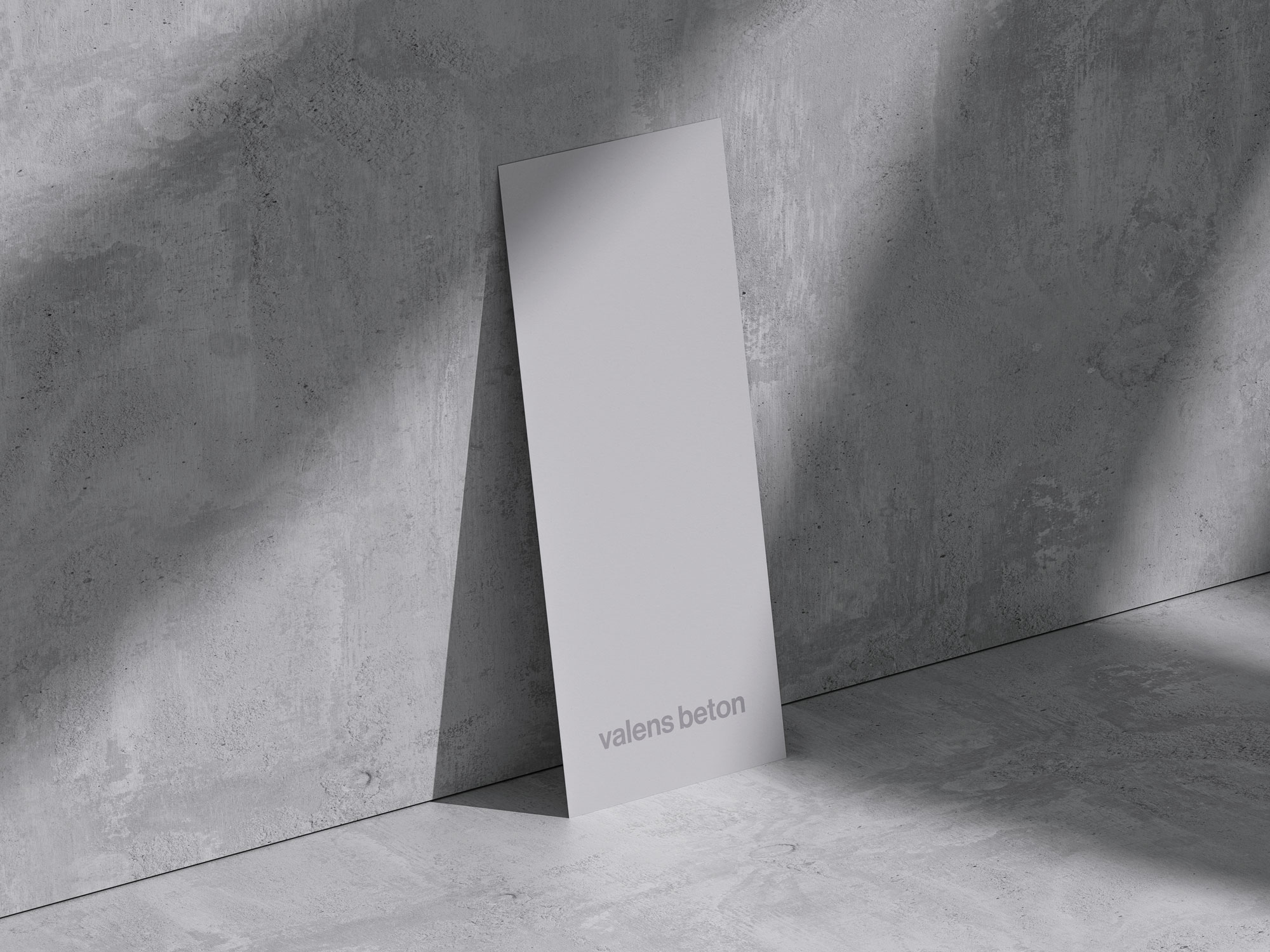 Minimal paper design with Valens beton logo, set against a concrete background, design by Mirko Maglica