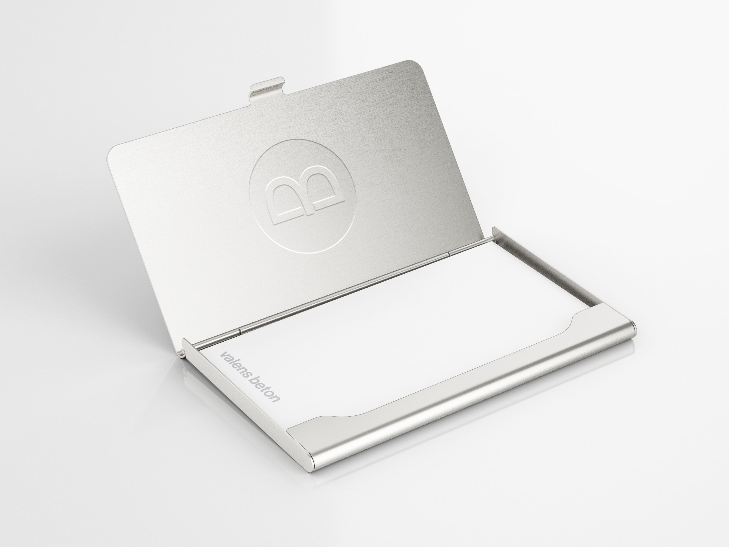 Open metal business card holder with Valens beton card and engraved symbol, minimalist design by Mirko Maglica