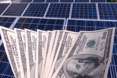 Money and solar panels