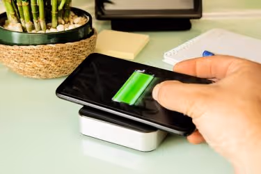 Someone charging their phone wirelessly