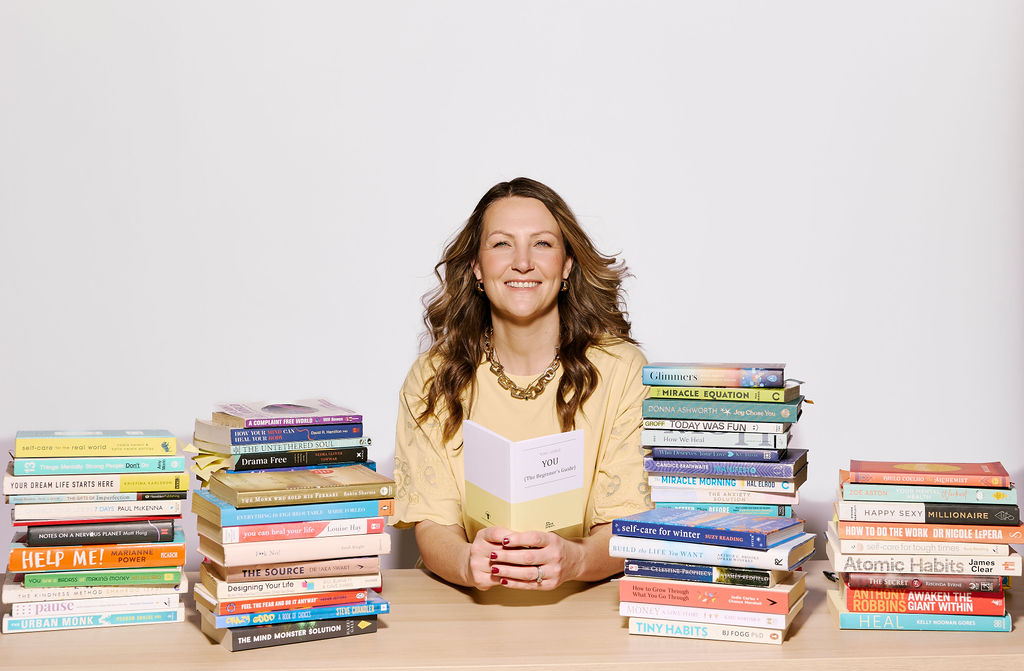 Toni Jones surrounded by self-help books