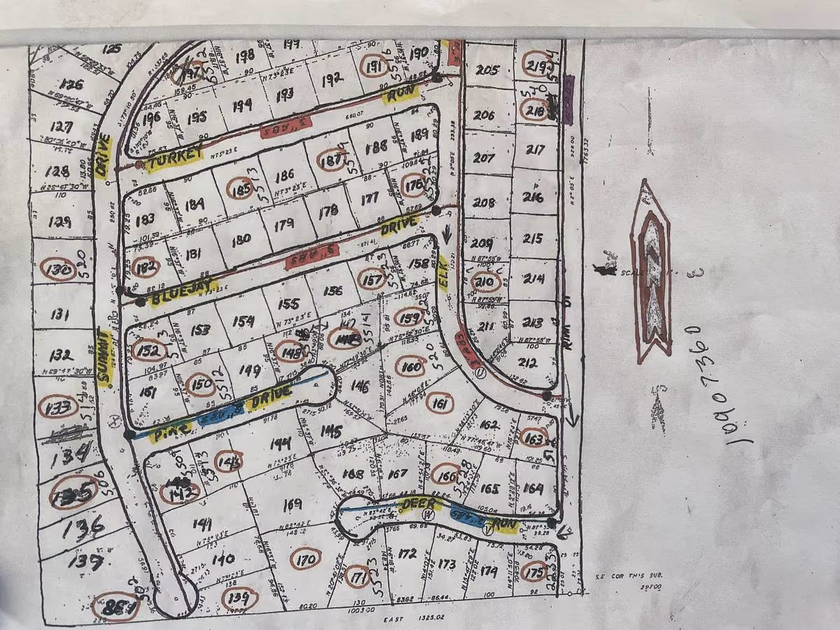 Hand-annotated paper plat map of water distribution system