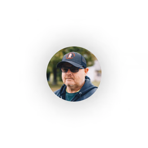 Water Utility General Manager wearing black baseball cap and glasses outdoors with trees in the background. He loves Ziptility because it makes his life easy