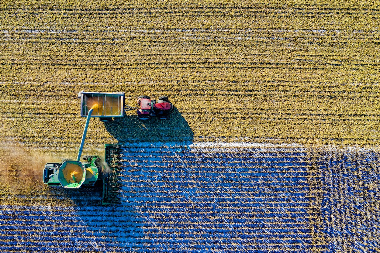 a tractor harvesting a field