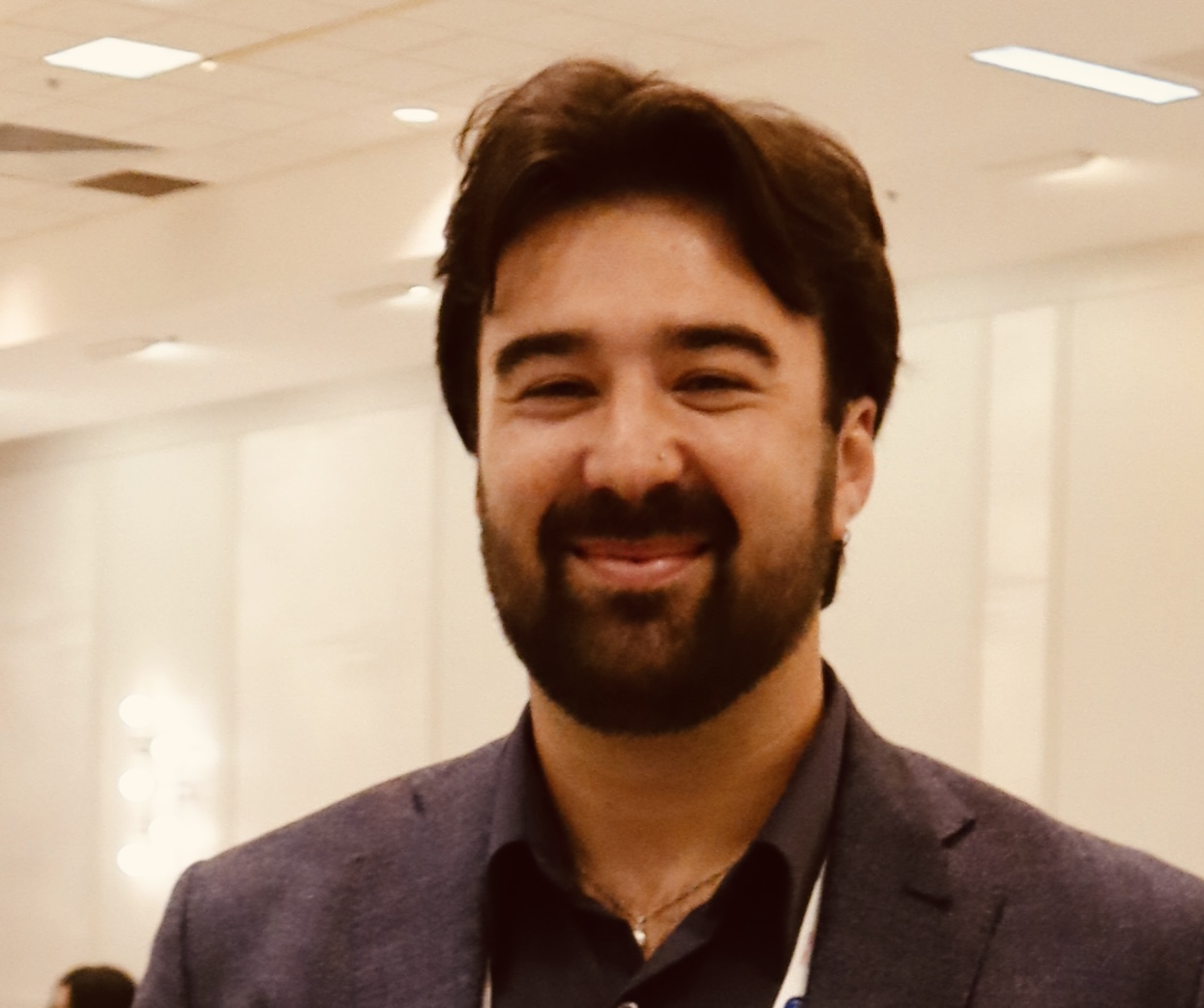 a man smiling at the camera
