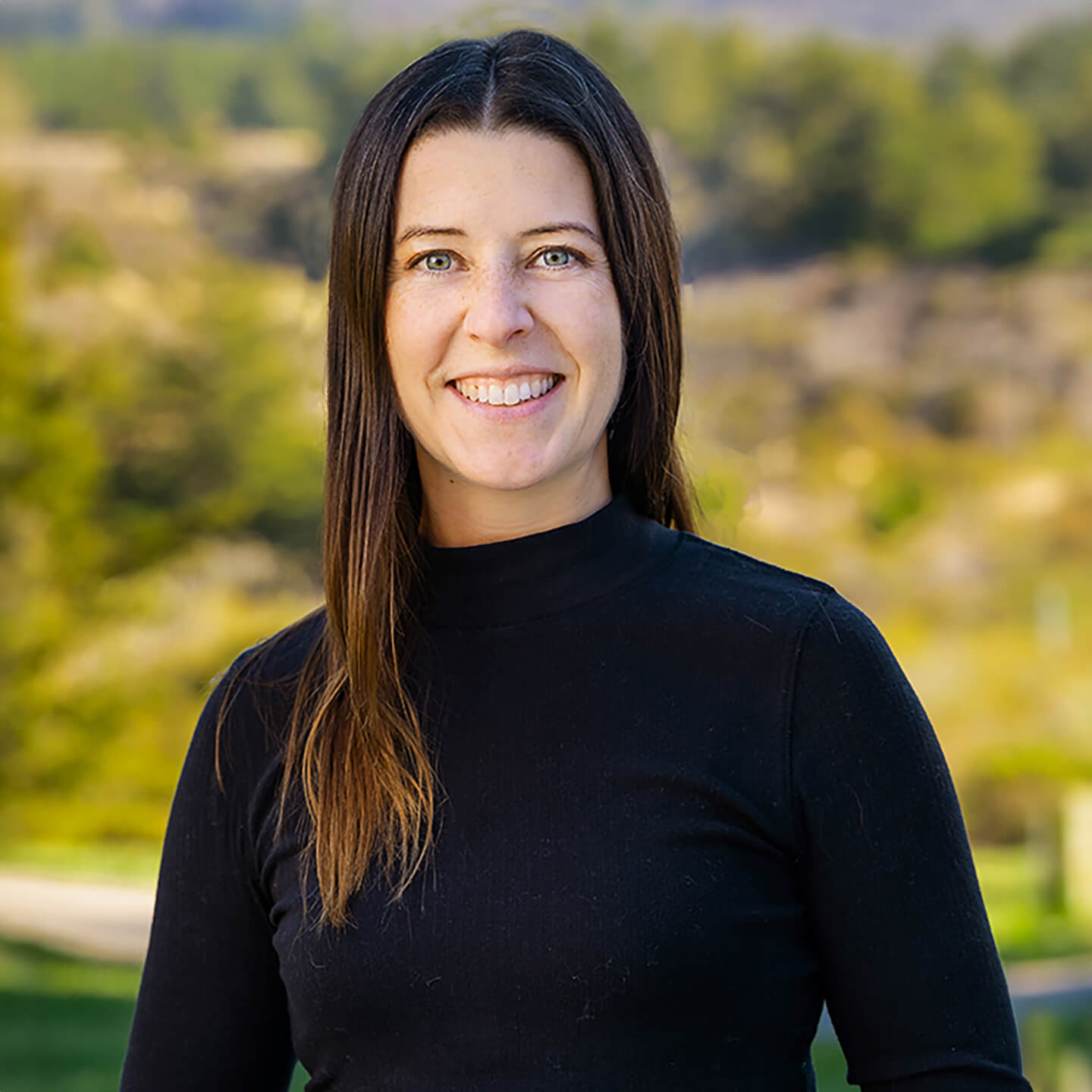 a woman smiling at camera