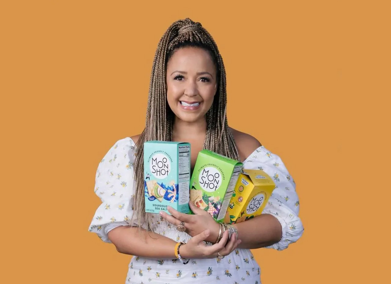 a woman holding a variety of boxes