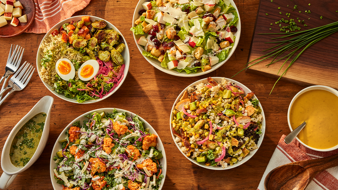 a group of bowls of salad