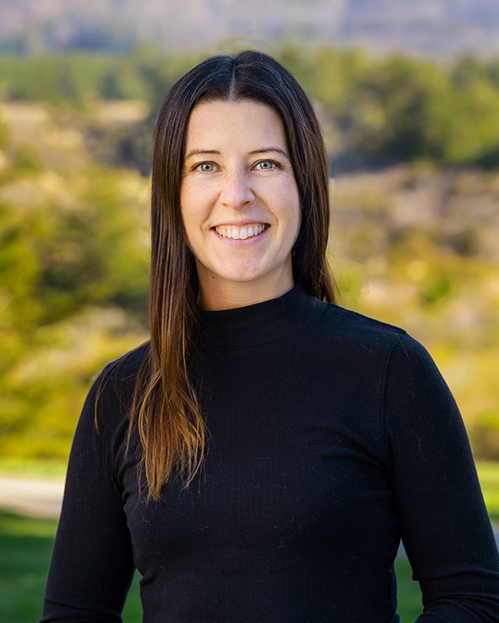 a woman smiling at camera