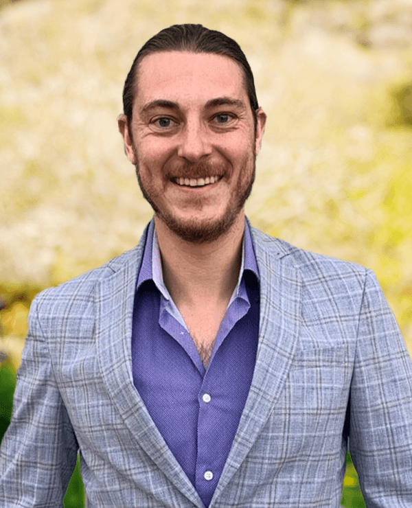 a man smiling at the camera