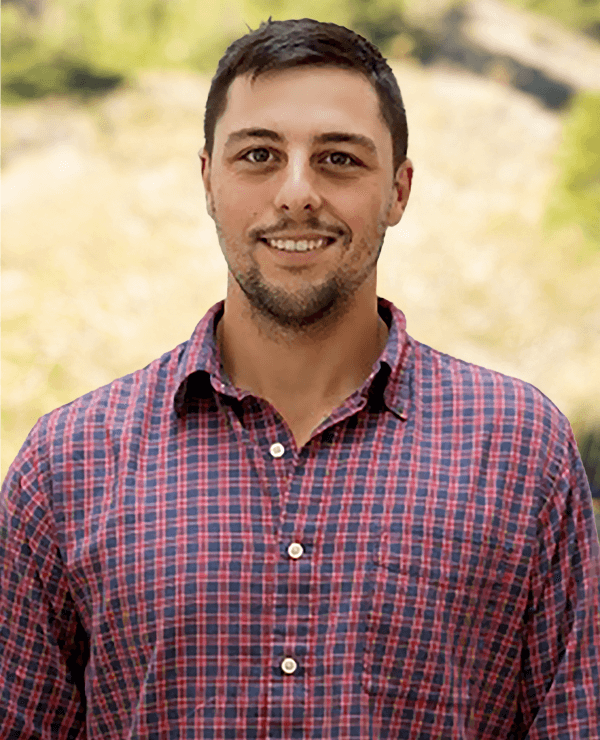 a man smiling at the camera