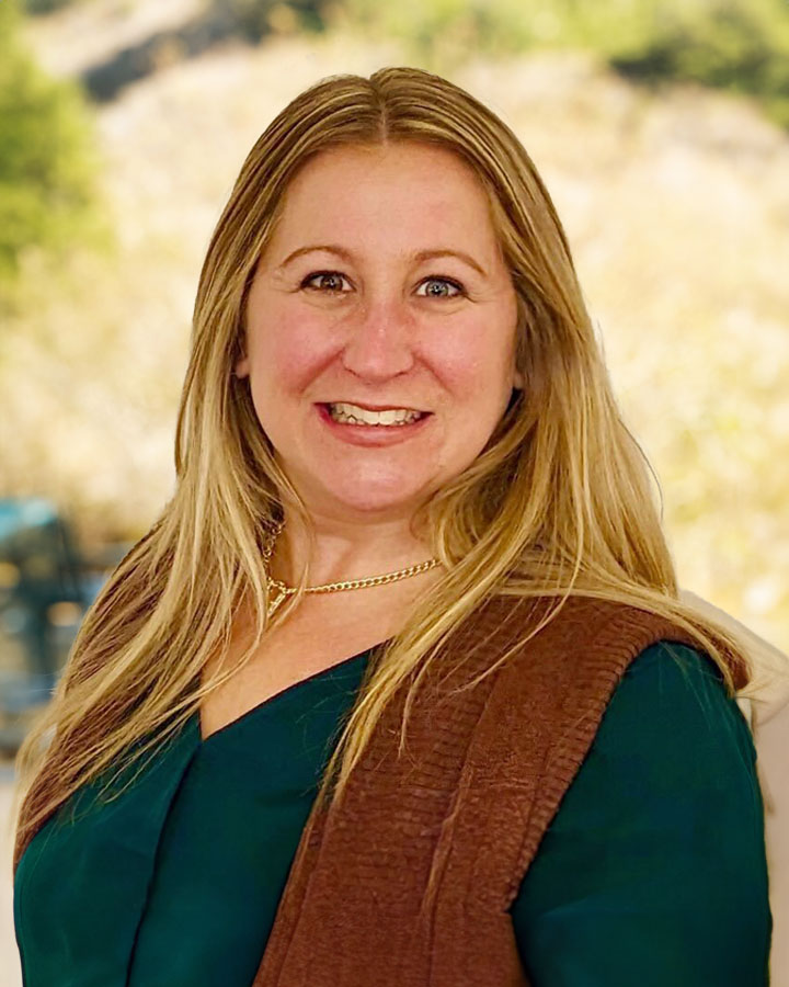 a woman smiling for a picture