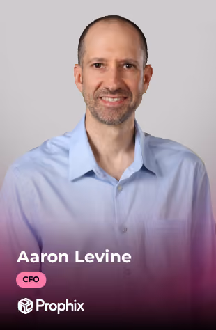 Headshot of Aaron Levine, CFO, wearing a light blue shirt with a gray background.