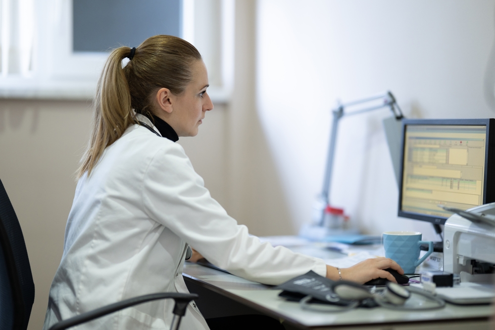 Clinician reviewing results on a desktop computer