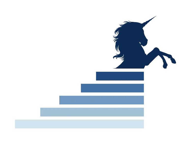 Geometric dark blue unicorn head sculpture mounted on a white brick wall.
